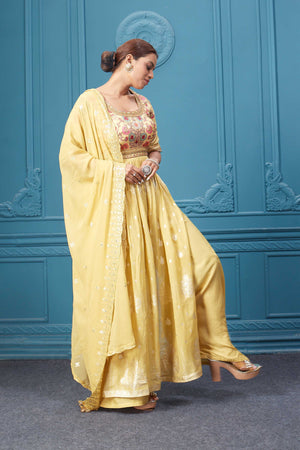 Shop a yellow naira cut suit set with mirror work and embroidered kurta, plazzo, 3/4th sleeves, and beautiful mirror work embroidered dupatta. Dazzle on special occasions with exquisite Indian designer dresses, sharara suits, Anarkali suits, bridal lehengas, and sharara suits from Pure Elegance Indian clothing store in the USA. Shop online from Pure Elegance.