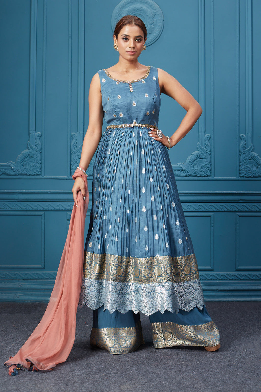 Buy a blue embroidered sleeveless Anarkali kurta with an embroidered belt. Dazzle on special occasions with exquisite Indian designer dresses, sharara suits, Anarkali suits, bridal lehengas, and sharara suits from Pure Elegance Indian clothing store in the USA. Shop online from Pure Elegance.