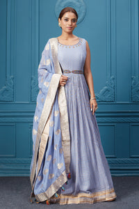 Buy a light blue embroidered sleeveless Anarkali kurta featuring embroidery, belt, and an embroidered dupatta with tassels. Dazzle on special occasions with exquisite Indian designer dresses, sharara suits, Anarkali suits, bridal lehengas, and sharara suits from Pure Elegance Indian clothing store in the USA. Shop online from Pure Elegance.