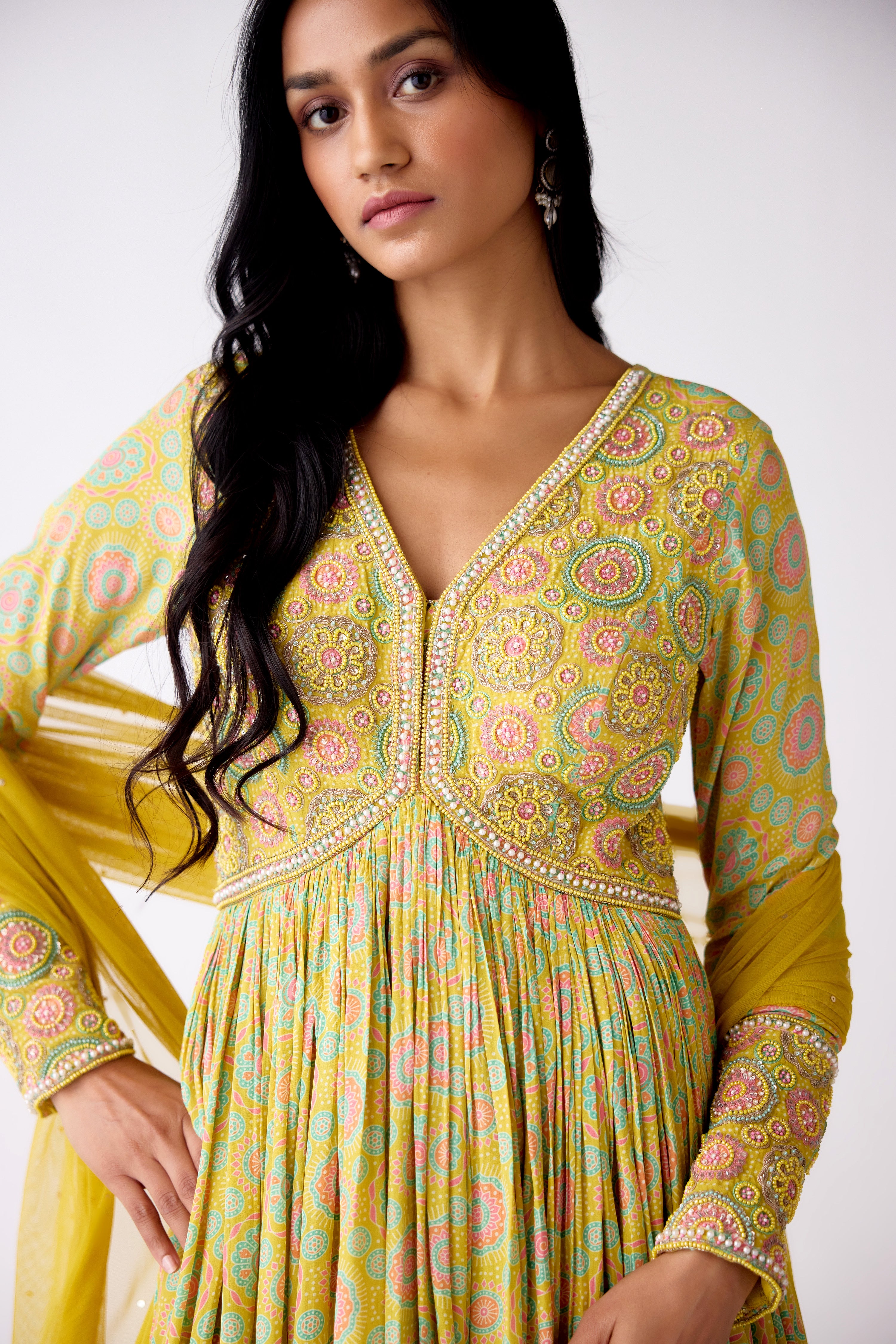 Shop yellow printed beads and sequin work crepe Anarkali online in USA. Shop the best and latest designs in embroidered sarees, designer sarees, Anarkali suit, lehengas, sharara suits for weddings and special occasions from Pure Elegance Indian fashion store in USA.-closeup