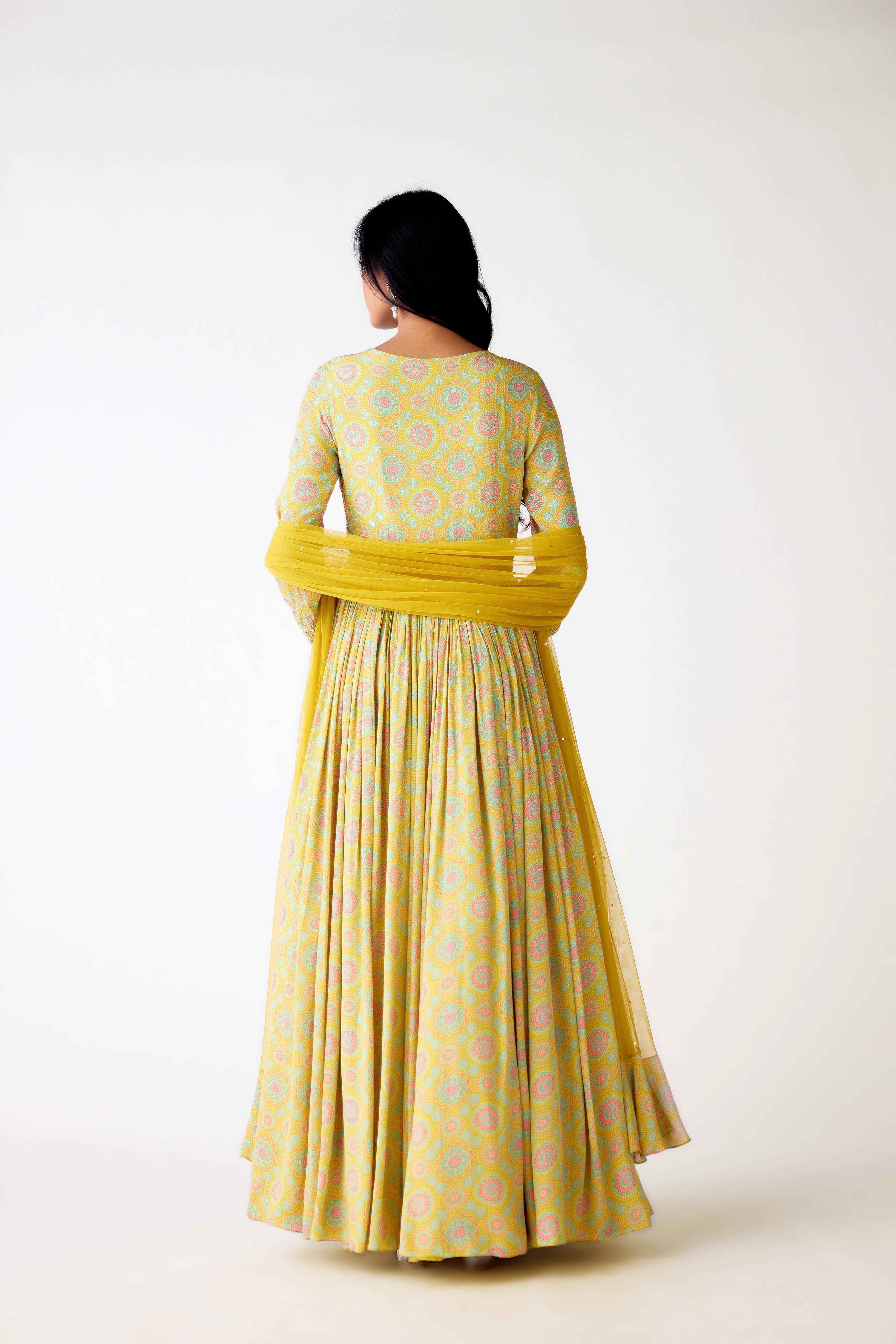 Shop yellow printed beads and sequin work crepe Anarkali online in USA. Shop the best and latest designs in embroidered sarees, designer sarees, Anarkali suit, lehengas, sharara suits for weddings and special occasions from Pure Elegance Indian fashion store in USA.-back