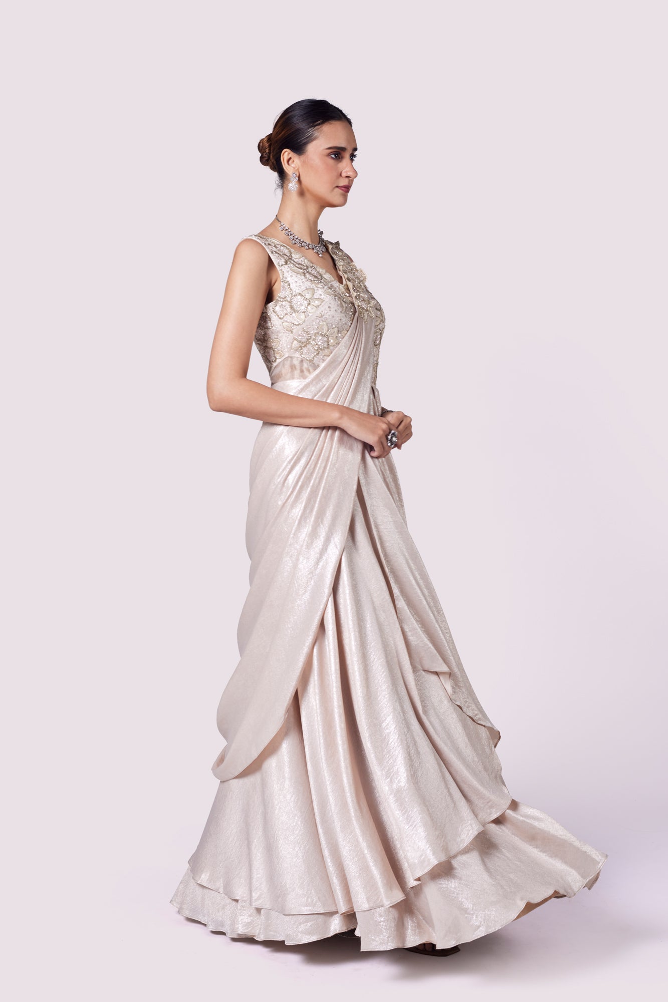 Shop stunning beige lycra embellished draped gown online in USA. Shop the best and latest designs in embroidered sarees, designer sarees, Anarkali suit, lehengas, sharara suits for weddings and special occasions from Pure Elegance Indian fashion store in USA.-side