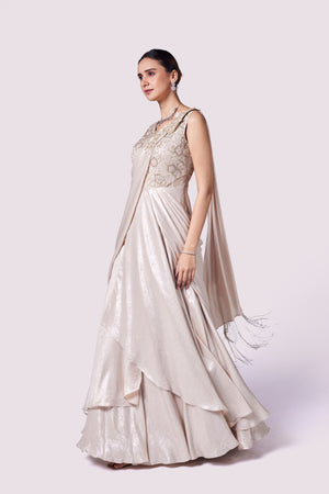 Shop stunning beige lycra embellished draped gown online in USA. Shop the best and latest designs in embroidered sarees, designer sarees, Anarkali suit, lehengas, sharara suits for weddings and special occasions from Pure Elegance Indian fashion store in USA.-gown