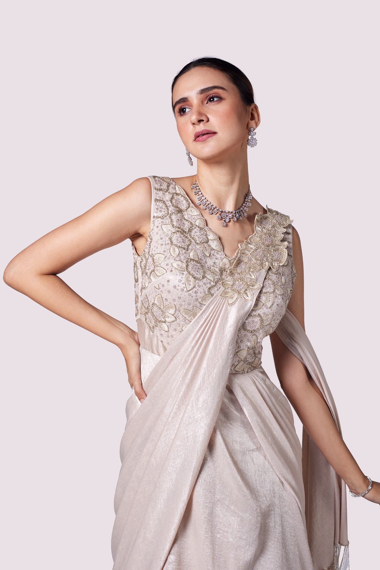 Shop stunning beige lycra embellished draped gown online in USA. Shop the best and latest designs in embroidered sarees, designer sarees, Anarkali suit, lehengas, sharara suits for weddings and special occasions from Pure Elegance Indian fashion store in USA.-closeup