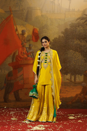 Buy mango yellow georgette chiffon sharara suit online in USA with cape. Shop the best and latest designs in embroidered sarees, designer sarees, Anarkali suit, lehengas, sharara suits for weddings and special occasions from Pure Elegance Indian fashion store in USA.-front