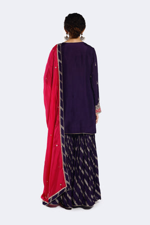 Buy purple zari organza satin gharara suit online in USA with pink dupatta. Shop the best and latest designs in embroidered sarees, designer sarees, Anarkali suit, lehengas, sharara suits for weddings and special occasions from Pure Elegance Indian fashion store in USA.-back