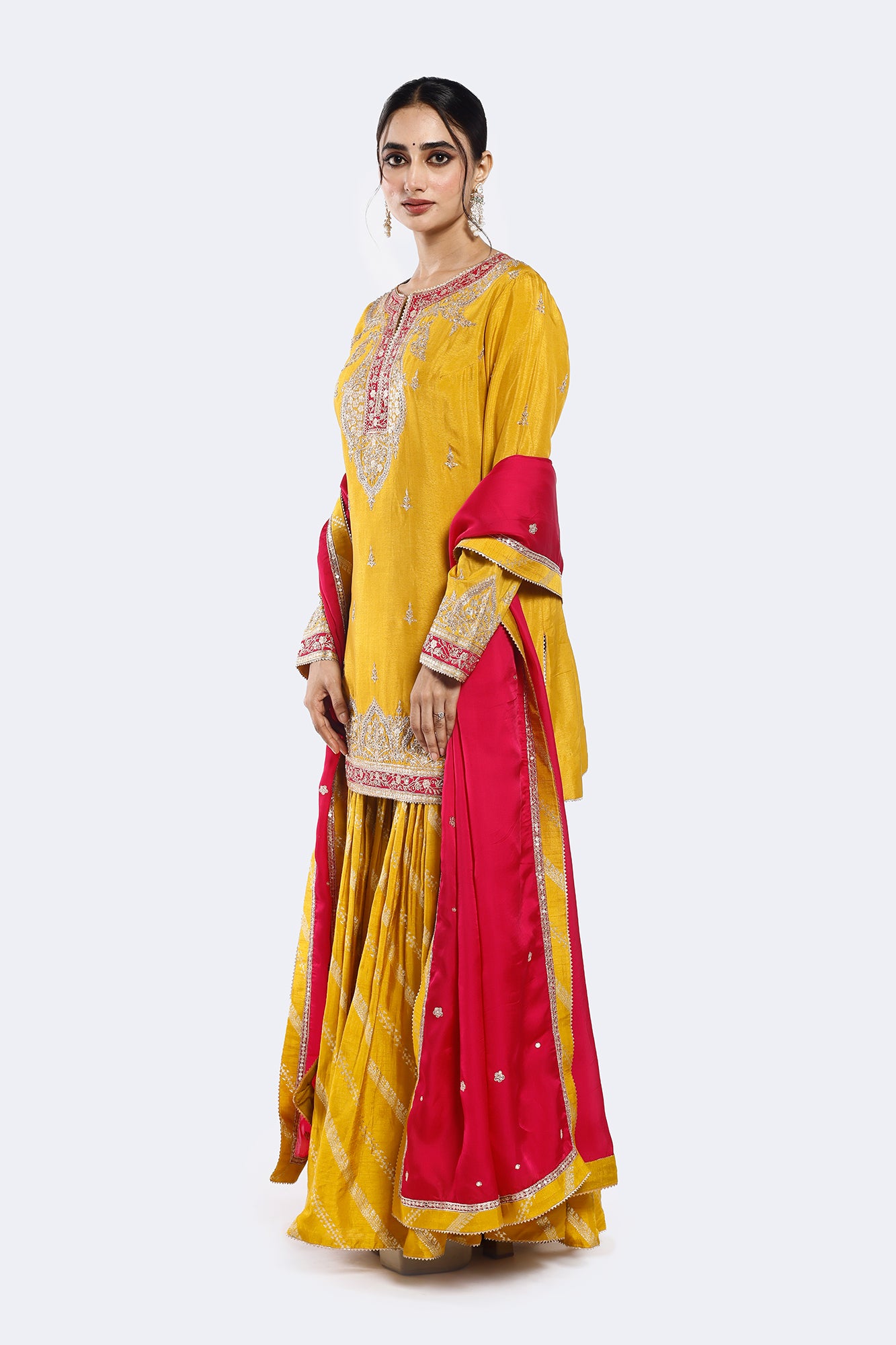 Shop yellow embroidered organza satin gharara suit online in USA with pink dupatta. Shop the best and latest designs in embroidered sarees, designer sarees, Anarkali suit, lehengas, sharara suits for weddings and special occasions from Pure Elegance Indian fashion store in USA.-side