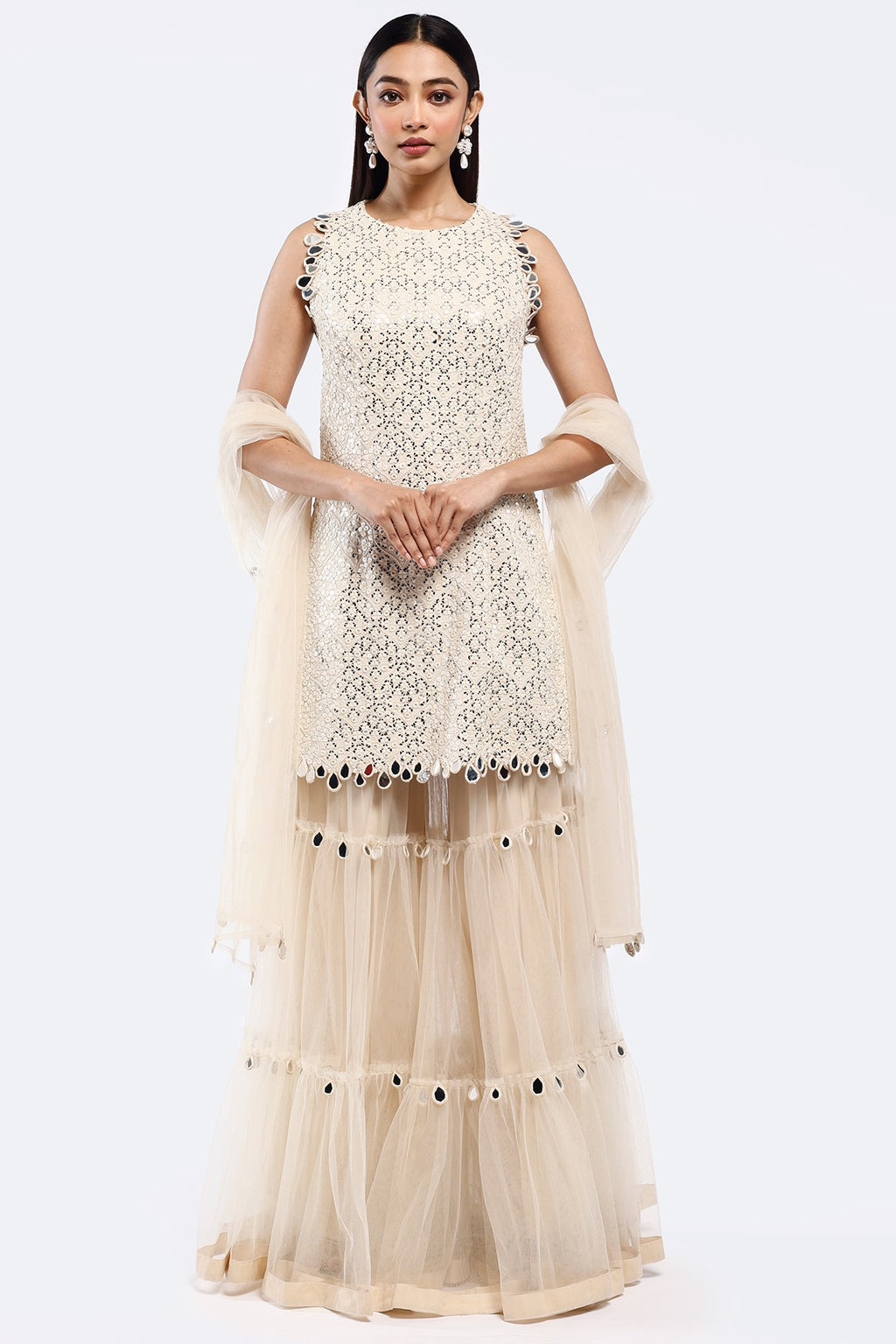 Shop cream mirror work net sharara suit online in USA with dupatta. Shop the best and latest designs in embroidered sarees, designer sarees, Anarkali suit, lehengas, sharara suits for weddings and special occasions from Pure Elegance Indian fashion store in USA.-full view