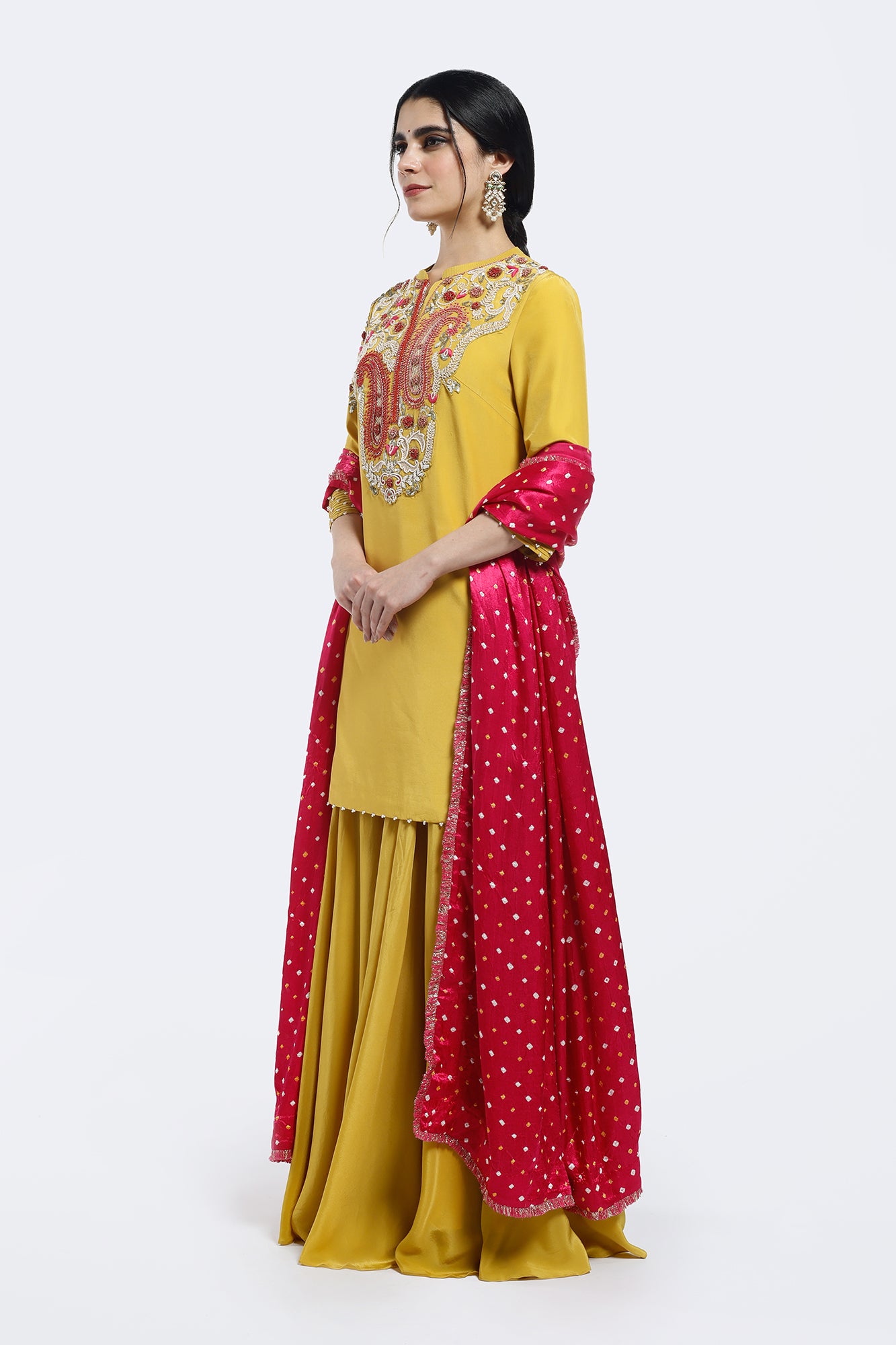 Shop yellow embroidered crepe sharara suit online in USA with bandhej dupatta. Shop the best and latest designs in embroidered sarees, designer sarees, Anarkali suit, lehengas, sharara suits for weddings and special occasions from Pure Elegance Indian fashion store in USA.-side