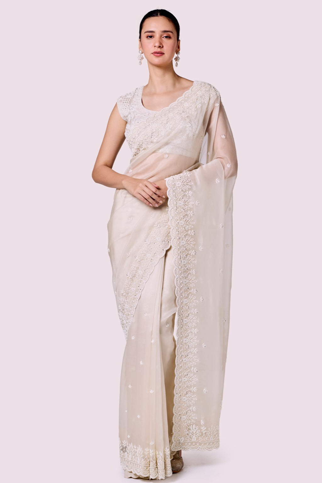 Buy ivory embroidered organza saree online in USA with embroidered designer blouse. Look your best at parties and weddings in beautiful designer sarees, embroidered sarees, handwoven sarees, silk sarees, organza saris from Pure Elegance Indian saree store in USA.-full view