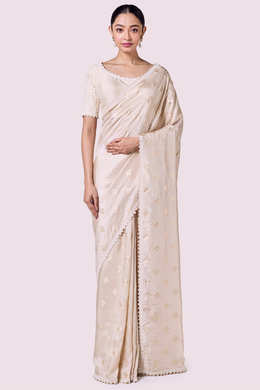 Shop ivory Banarasi saree online in USA with embellished border. Look your best at parties and weddings in beautiful designer sarees, embroidered sarees, handwoven sarees, silk sarees, organza saris from Pure Elegance Indian saree store in USA.-full view