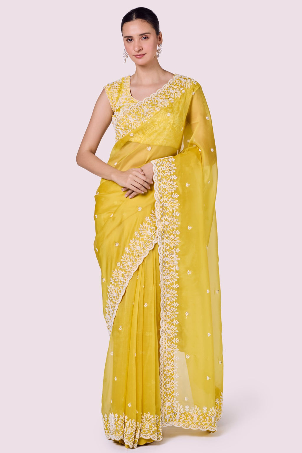 Shop yellow organza saree online in USA with heavy embroidered border. Look your best at parties and weddings in beautiful designer sarees, embroidered sarees, handwoven sarees, silk sarees, organza saris from Pure Elegance Indian saree store in USA.-full view