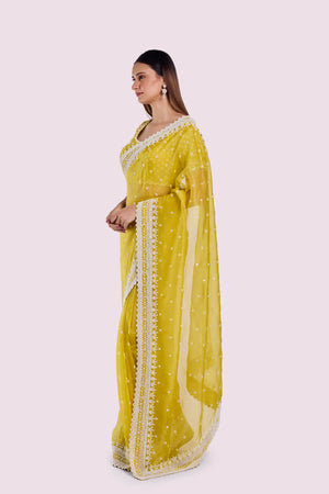 Buy yellow embroidered organza saree online in USA with blouse. Look your best at parties and weddings in beautiful designer sarees, embroidered sarees, handwoven sarees, silk sarees, organza saris from Pure Elegance Indian saree store in USA.-side