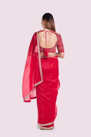 Buy red organza saree online in USA with embroidered blouse. Look your best at parties and weddings in beautiful designer sarees, embroidered sarees, handwoven sarees, silk sarees, organza saris from Pure Elegance Indian saree store in USA.-back