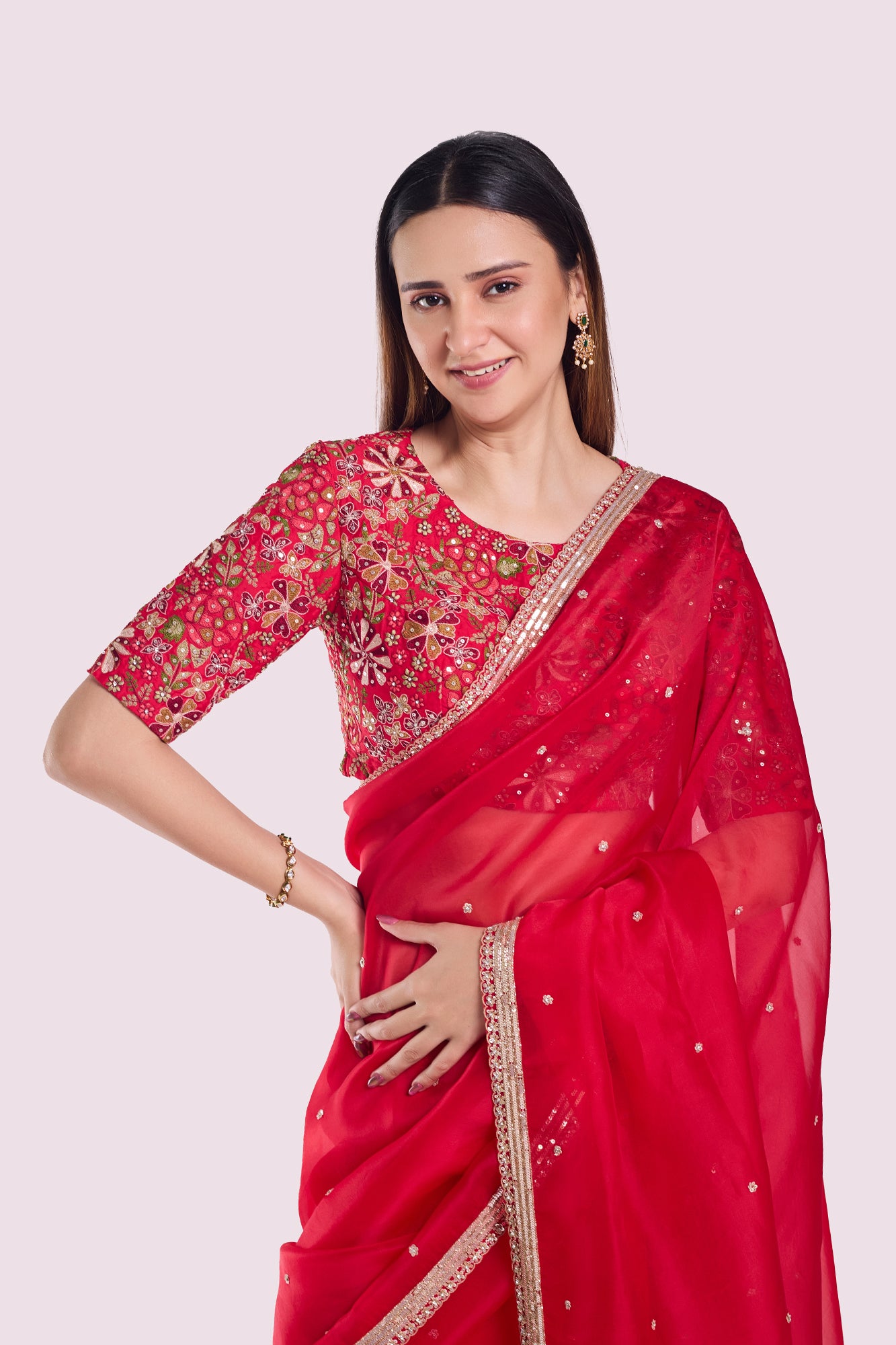 Buy red organza saree online in USA with embroidered blouse. Look your best at parties and weddings in beautiful designer sarees, embroidered sarees, handwoven sarees, silk sarees, organza saris from Pure Elegance Indian saree store in USA.-closeup