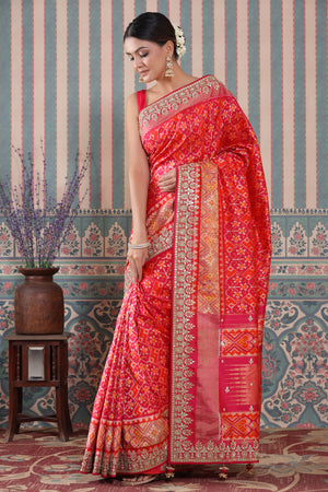 Shop pink and orange Patola silk sari online in USA with embroidered border. Make a fashion statement at weddings with stunning designer sarees, embroidered sarees with blouse, wedding sarees, handloom sarees from Pure Elegance Indian fashion store in USA.-saree