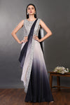 Shop a grey-black drape saree with embroidered blouse. Make a fashion statement on festive occasions and weddings with designer sarees, designer suits, Indian dresses, Anarkali suits, palazzo suits, designer gowns, sharara suits, and embroidered sarees from Pure Elegance Indian fashion store in the USA.