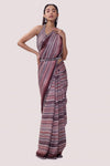 Shop a Beautiful wine georgette saree featuring cut dana and mirror work. It comes with a decorative blouse. Make a fashion statement on festive occasions and weddings with designer sarees, designer suits, Indian dresses, Anarkali suits, palazzo suits, designer gowns, sharara suits, and embroidered sarees from Pure Elegance Indian fashion store in the USA.