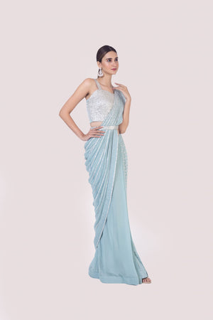 Shop light blue drape saree embedded with mirror work. Make a fashion statement on festive occasions and weddings with designer sarees, designer suits, Indian dresses, Anarkali suits, palazzo suits, designer gowns, sharara suits, and embroidered sarees from Pure Elegance Indian fashion store in the USA.