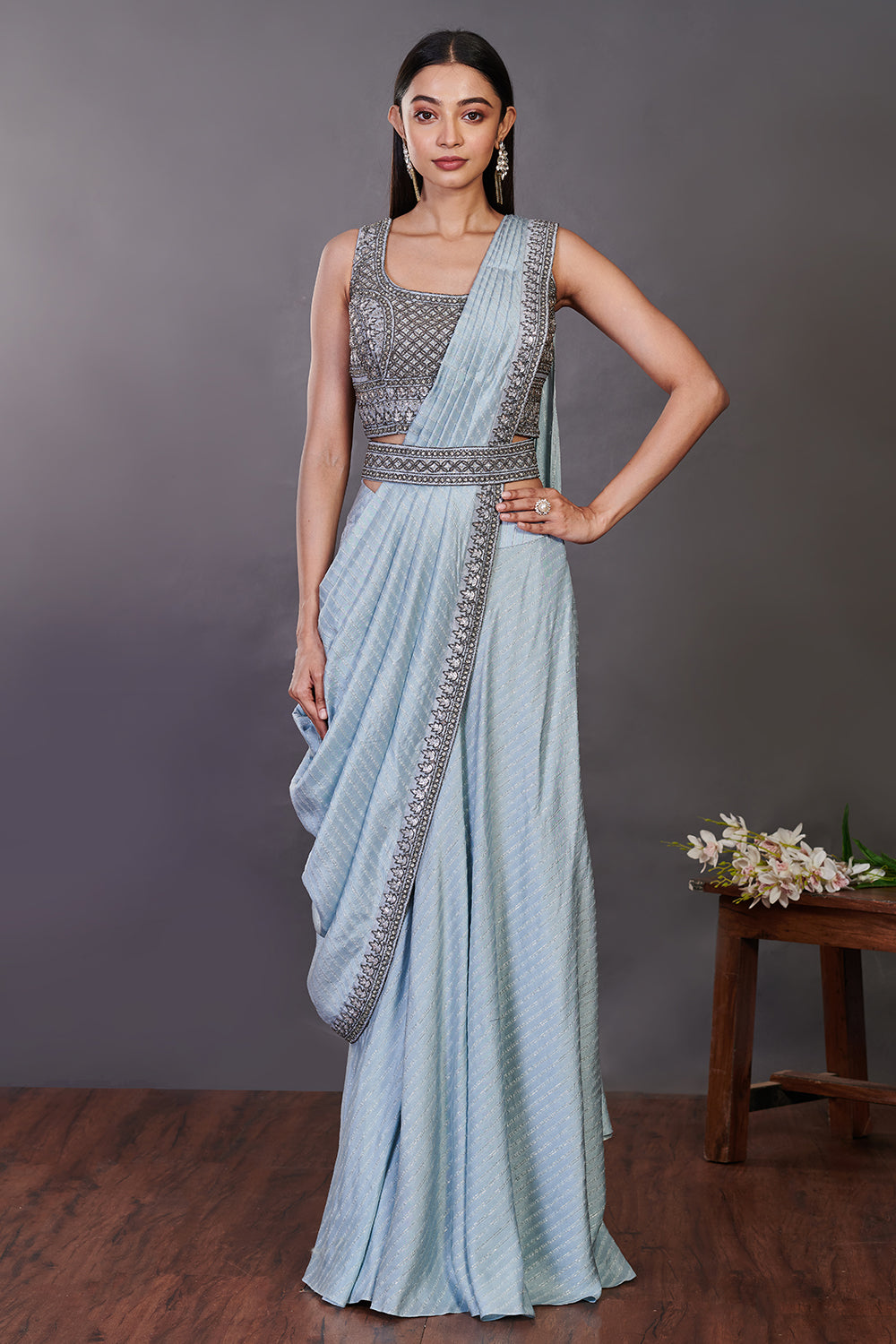 Shop a blue pre-stiched saree set with embroidered blouse and belt. Make a fashion statement on festive occasions and weddings with designer sarees, designer suits, Indian dresses, Anarkali suits, palazzo suits, designer gowns, sharara suits, and embroidered sarees from Pure Elegance Indian fashion store in the USA.