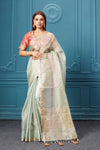 Shop beautiful pastel green organza silk sari online in USA with pink embroidered blouse. Look royal at weddings and festive occasions in exquisite designer sarees, handwoven sarees, pure silk saris, Banarasi sarees, Kanchipuram silk sarees from Pure Elegance Indian saree store in USA. -full view