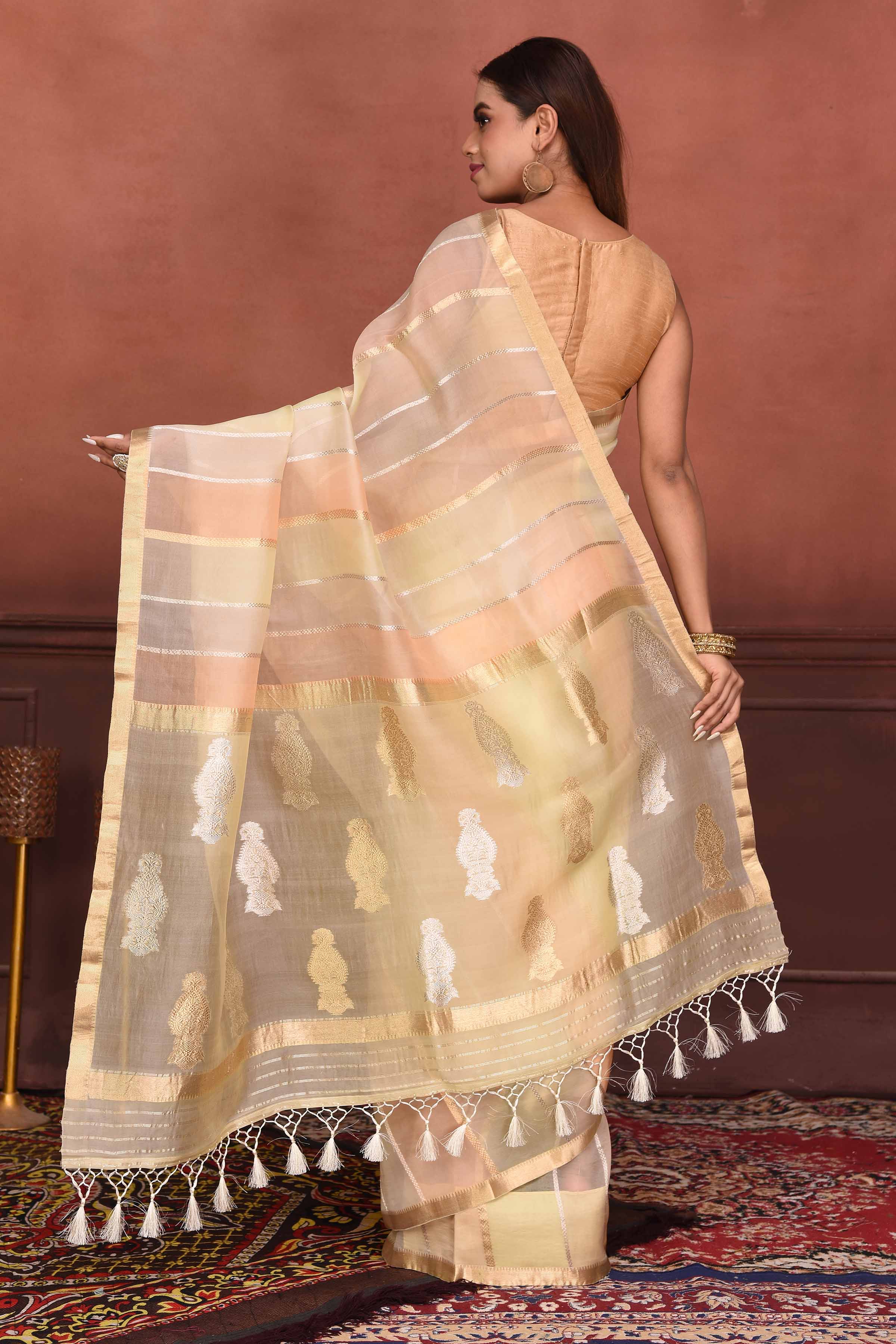 Buy stunning peach striped zari organza Banarasi saree online in USA. Look your best on festive occasions in latest designer sarees, pure silk sarees, Kanchipuram silk sarees, handwoven sarees, tussar silk sarees, embroidered sarees from Pure Elegance Indian clothing store in USA.-back