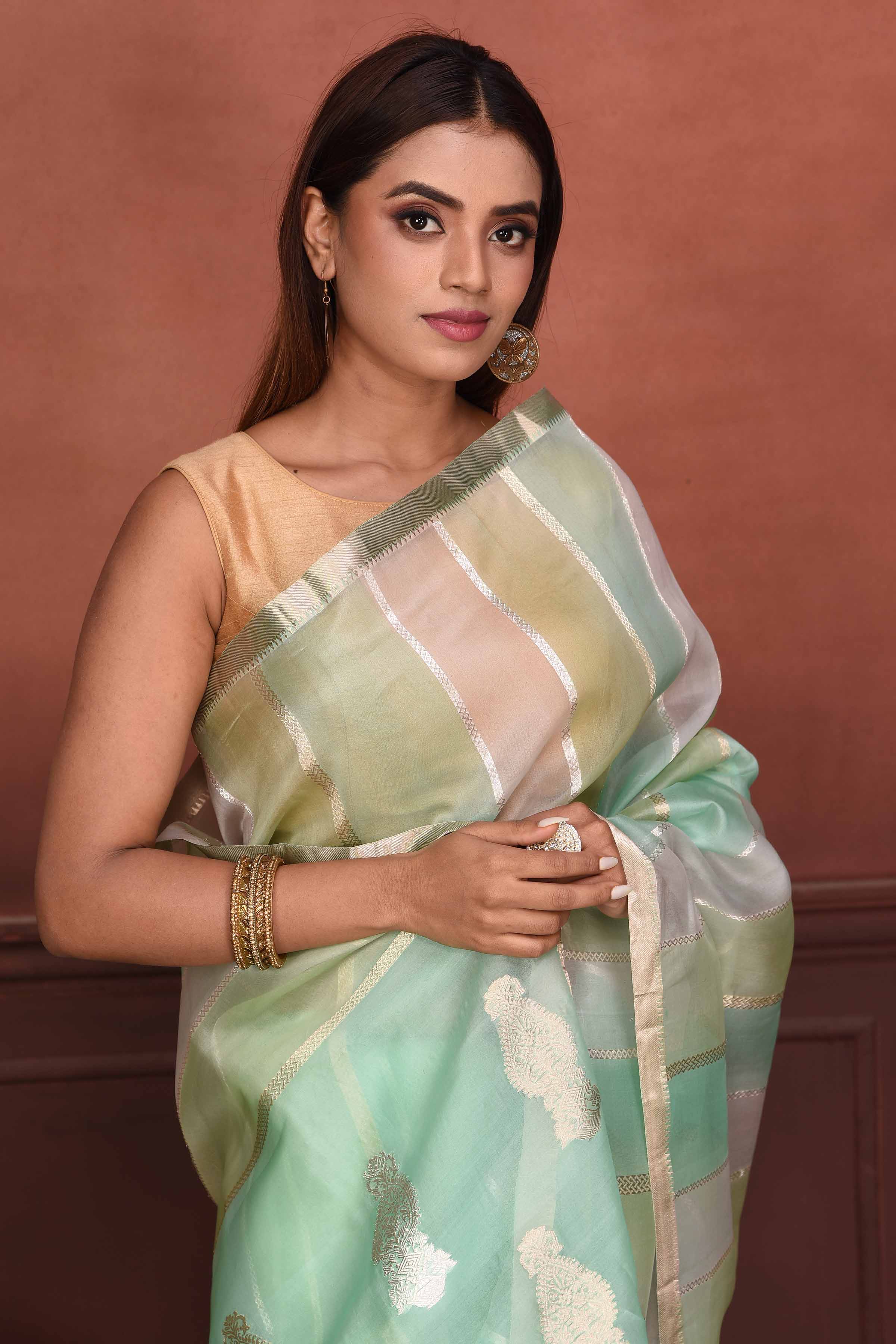 Buy pastel green and zari stripes organza Banarasi saree online in USA. Look your best on festive occasions in latest designer sarees, pure silk sarees, Kanchipuram silk sarees, handwoven sarees, tussar silk sarees, embroidered sarees from Pure Elegance Indian clothing store in USA.-closeup