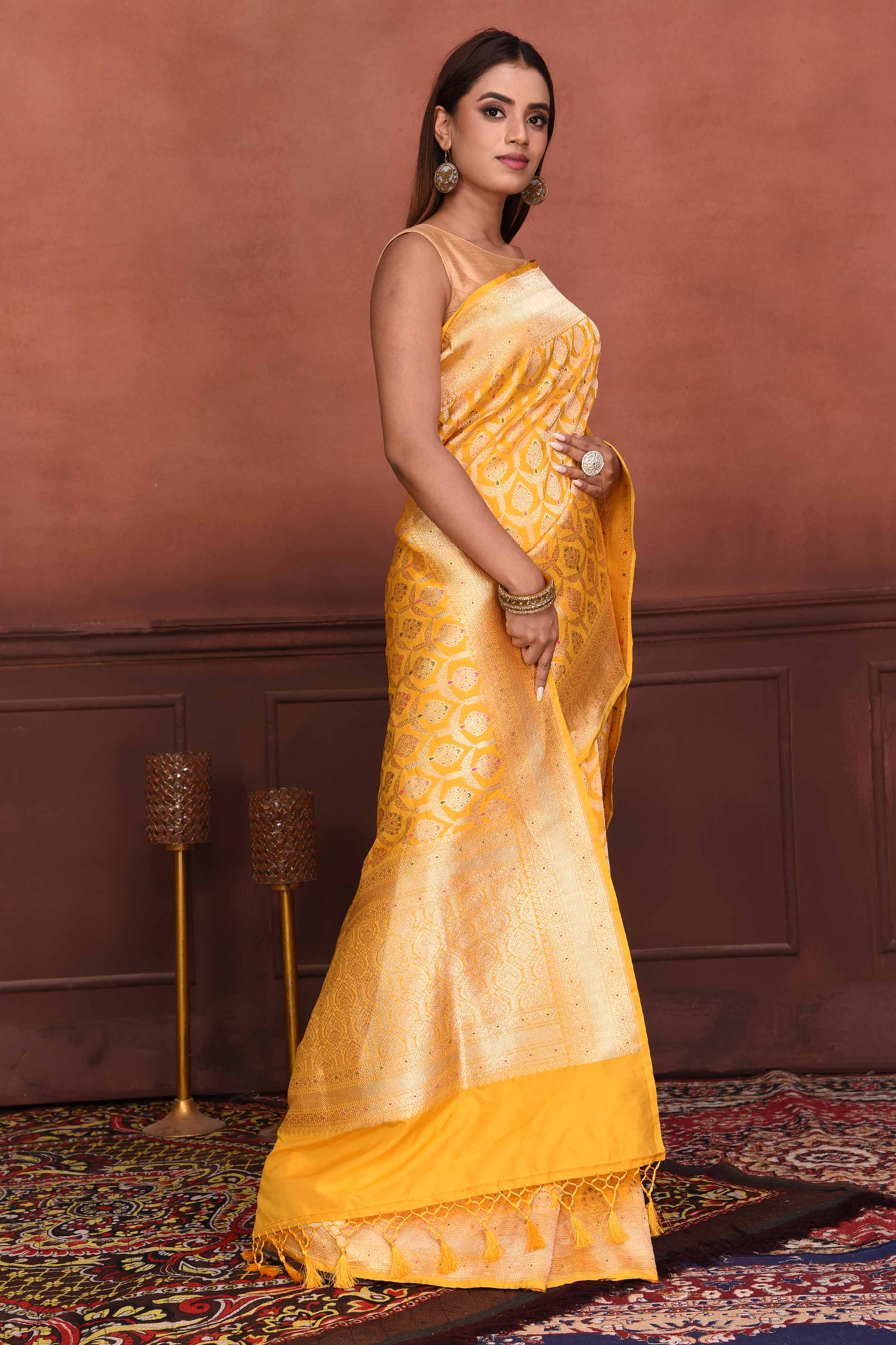 A light golden tissue saree with woven borders on geometric pattern with a  gota work blouse . This Bridal saree is adds beauty and grace to its  very... | By KavaniFacebook