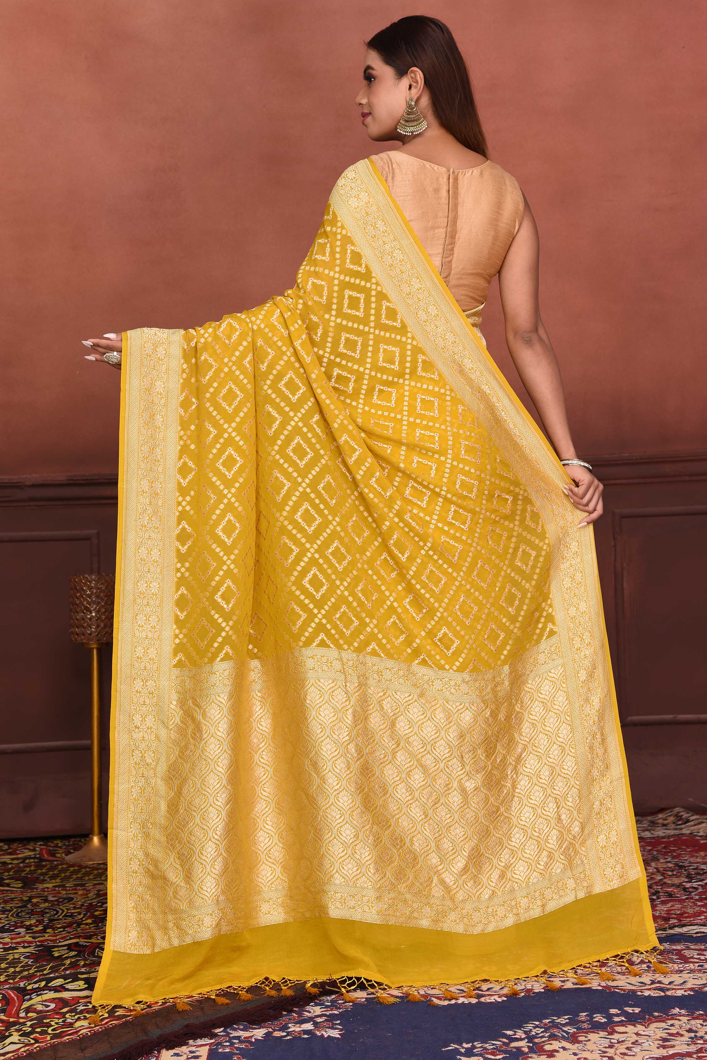 Shop mango yellow Katan silk Banarasi saree online in USA with zari work. Look your best on festive occasions in latest designer sarees, pure silk sarees, Kanchipuram silk sarees, handwoven sarees, tussar silk sarees, embroidered sarees from Pure Elegance Indian clothing store in USA.-back