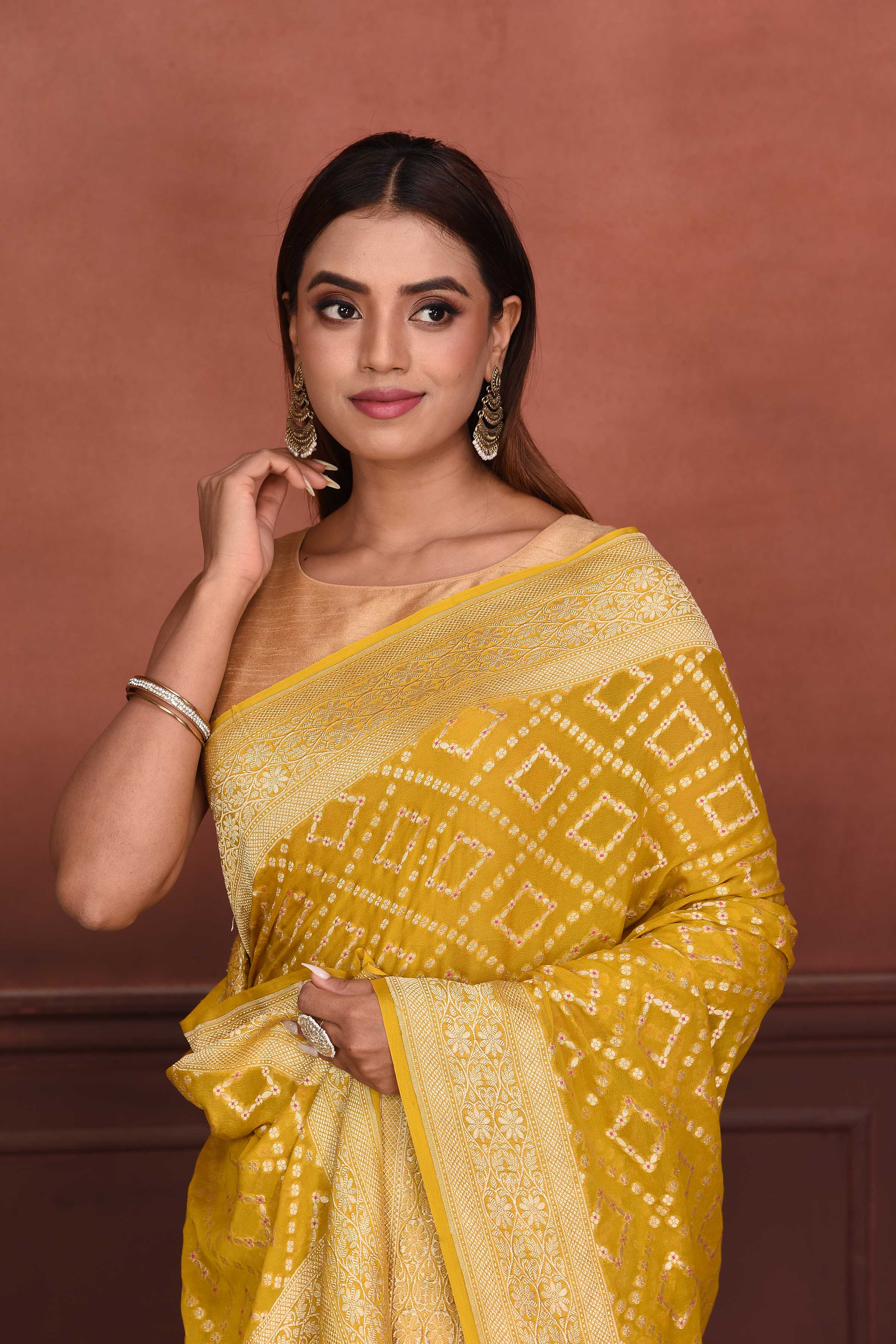 Shop mango yellow Katan silk Banarasi saree online in USA with zari work. Look your best on festive occasions in latest designer sarees, pure silk sarees, Kanchipuram silk sarees, handwoven sarees, tussar silk sarees, embroidered sarees from Pure Elegance Indian clothing store in USA.-closeup