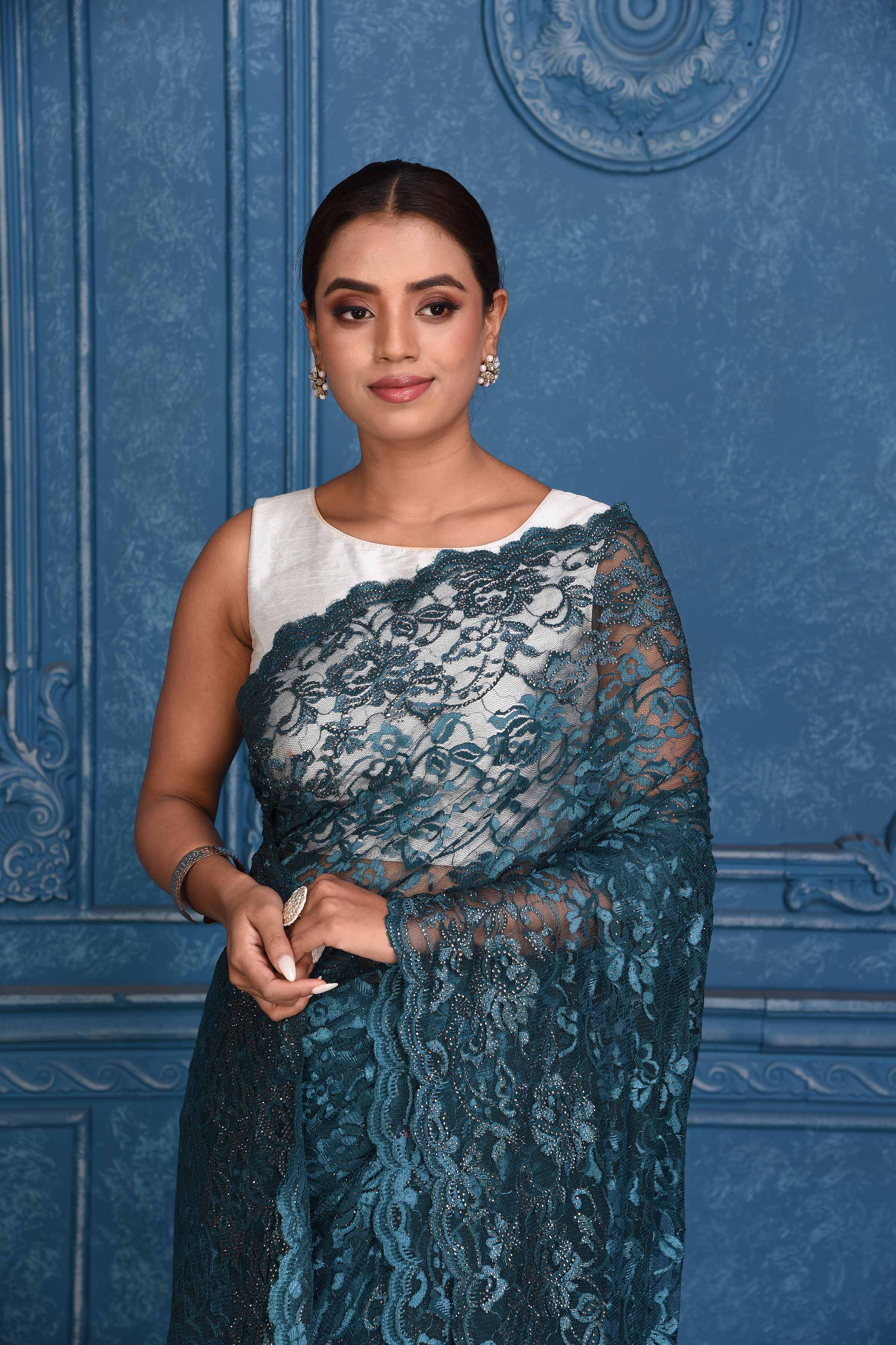 Shop beautiful teal designer lace saree online in USA. Look royal at weddings and festive occasions in exquisite designer sarees, handwoven sarees, pure silk saris, Banarasi sarees, Kanchipuram silk sarees from Pure Elegance Indian saree store in USA. -closeup