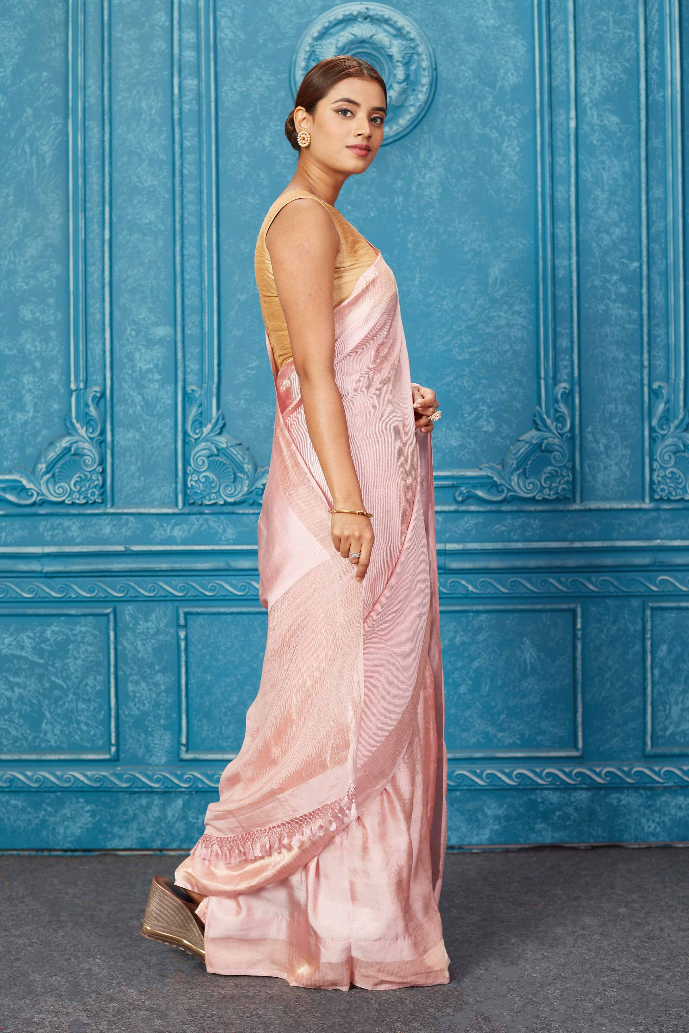 Buy beautiful powder pink Banarasi silk sari online in USA. Keep your ethnic wardrobe up to date with latest designer sarees, pure silk sarees, Kanchipuram silk sarees, handwoven sarees, tussar silk sarees, embroidered sarees from Pure Elegance Indian saree store in USA.-side