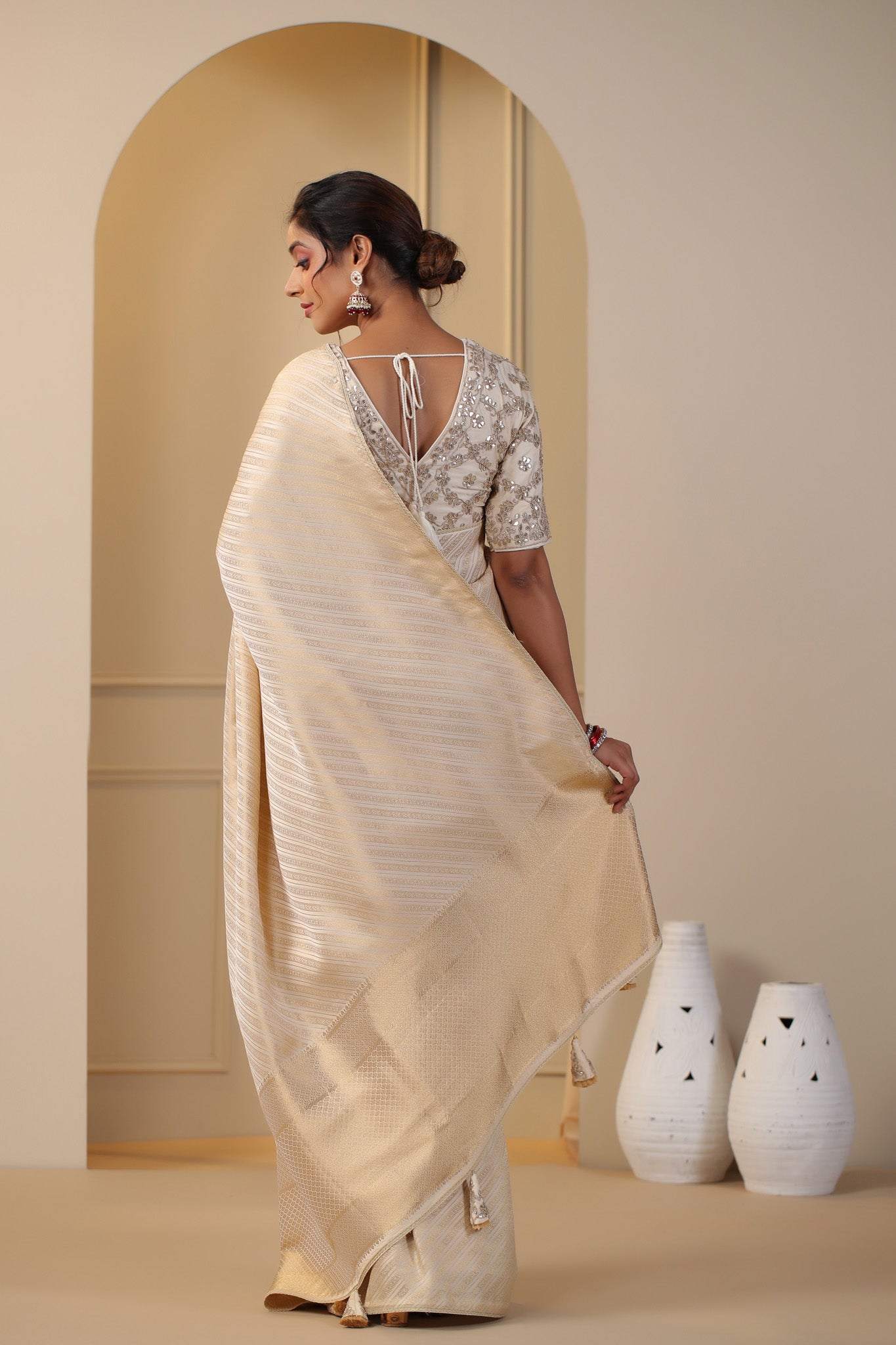 Shop cream silk sari online in USA with embroidered saree blouse. Make a fashion statement on festive occasions and weddings with designer suits, Indian dresses, Anarkali suits, palazzo suits, designer sarees, sharara suits, Bollywood saris from Pure Elegance Indian fashion store in USA.-back