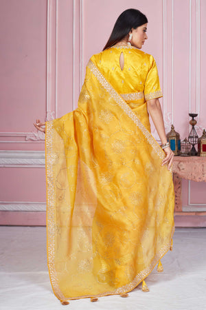 Buy yellow gota patti embroidery organza sari online in USA with blouse. Look your best on festive occasions in latest designer sarees, pure silk sarees, Kanjivaram silk saris, handwoven saris, tussar silk sarees, embroidered saris from Pure Elegance Indian clothing store in USA.-back