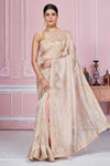 Shop stunning beige embroidered tissue silk sari online in USA. Look your best on festive occasions in latest designer sarees, pure silk sarees, Kanjivaram silk saris, handwoven saris, tussar silk sarees, embroidered saris from Pure Elegance Indian clothing store in USA.-full view