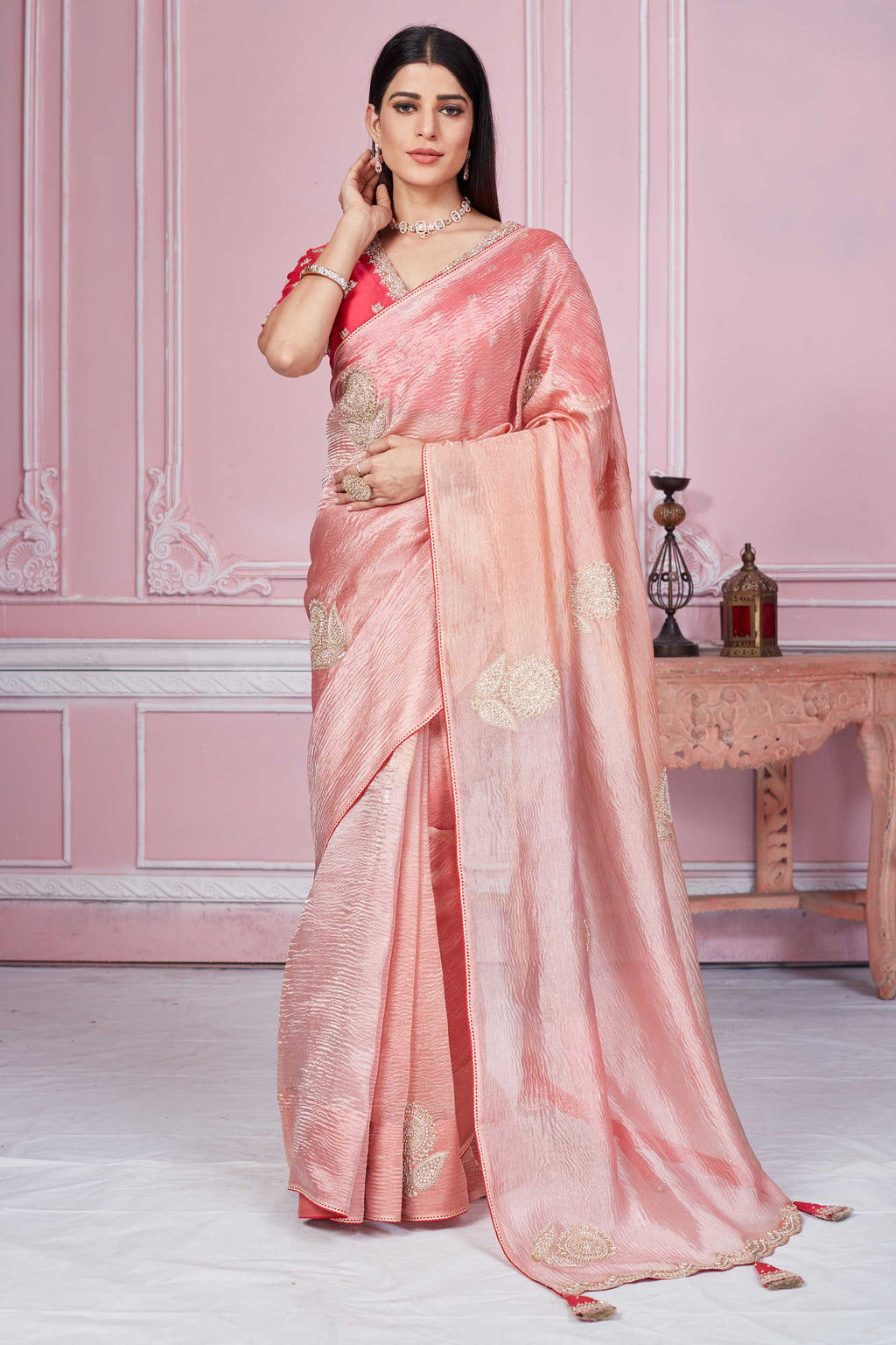 Buy peach embroidered tissue silk sari online in USA with red blouse. Look your best on festive occasions in latest designer sarees, pure silk sarees, Kanjivaram silk saris, handwoven saris, tussar silk sarees, embroidered saris from Pure Elegance Indian clothing store in USA.-full view