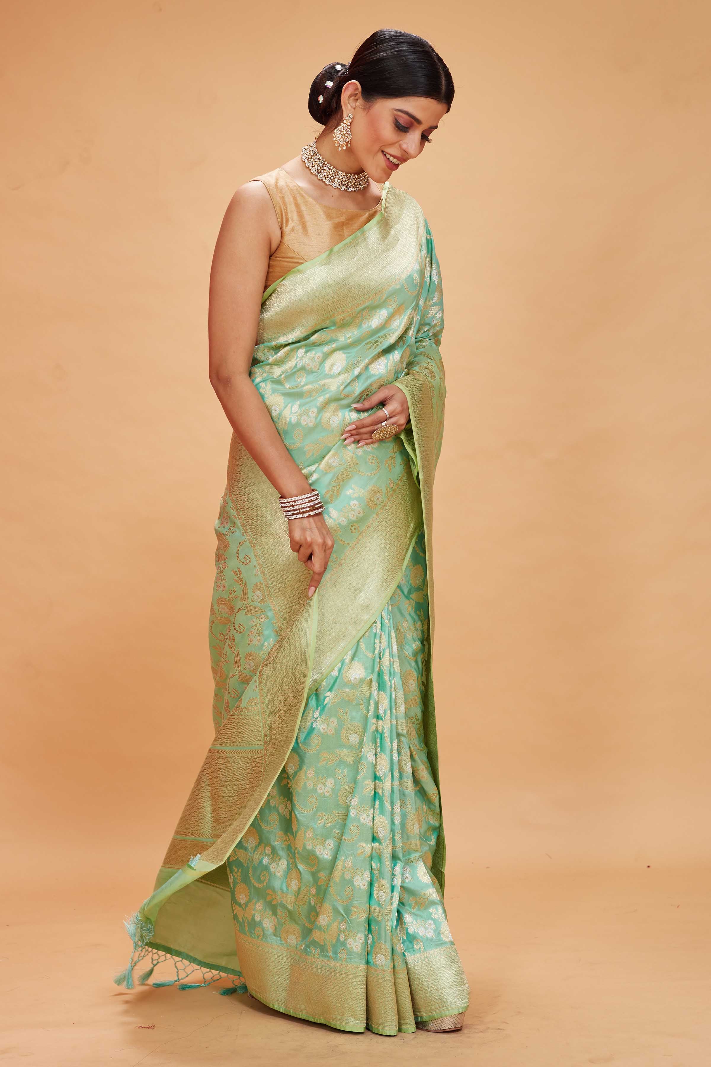 Buy pastel green katan silk Banarasi saree online in USA with zari jaal. Look your best on festive occasions in latest designer saris, pure silk sarees, Kanjivaram silk sarees, handwoven saris, tussar silk sarees, embroidered saris from Pure Elegance Indian clothing store in USA.-side