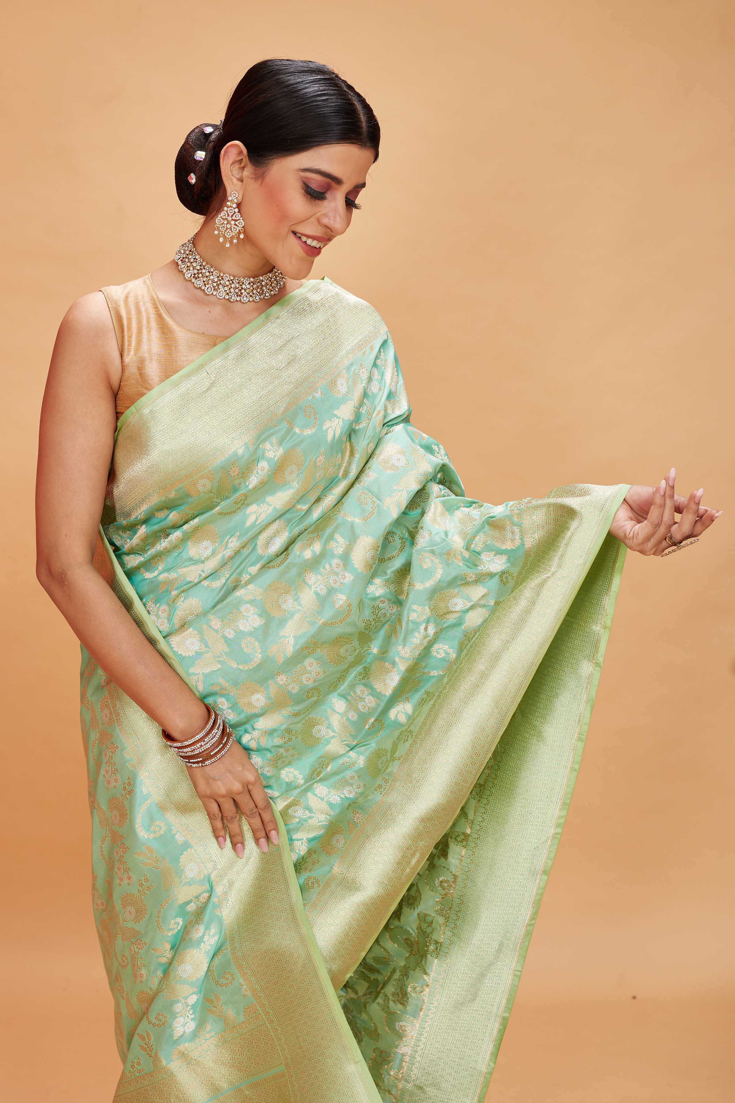 Buy pastel green katan silk Banarasi saree online in USA with zari jaal. Look your best on festive occasions in latest designer saris, pure silk sarees, Kanjivaram silk sarees, handwoven saris, tussar silk sarees, embroidered saris from Pure Elegance Indian clothing store in USA.-closeup