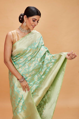 Buy pastel green katan silk Banarasi saree online in USA with zari jaal. Look your best on festive occasions in latest designer saris, pure silk sarees, Kanjivaram silk sarees, handwoven saris, tussar silk sarees, embroidered saris from Pure Elegance Indian clothing store in USA.-closeup