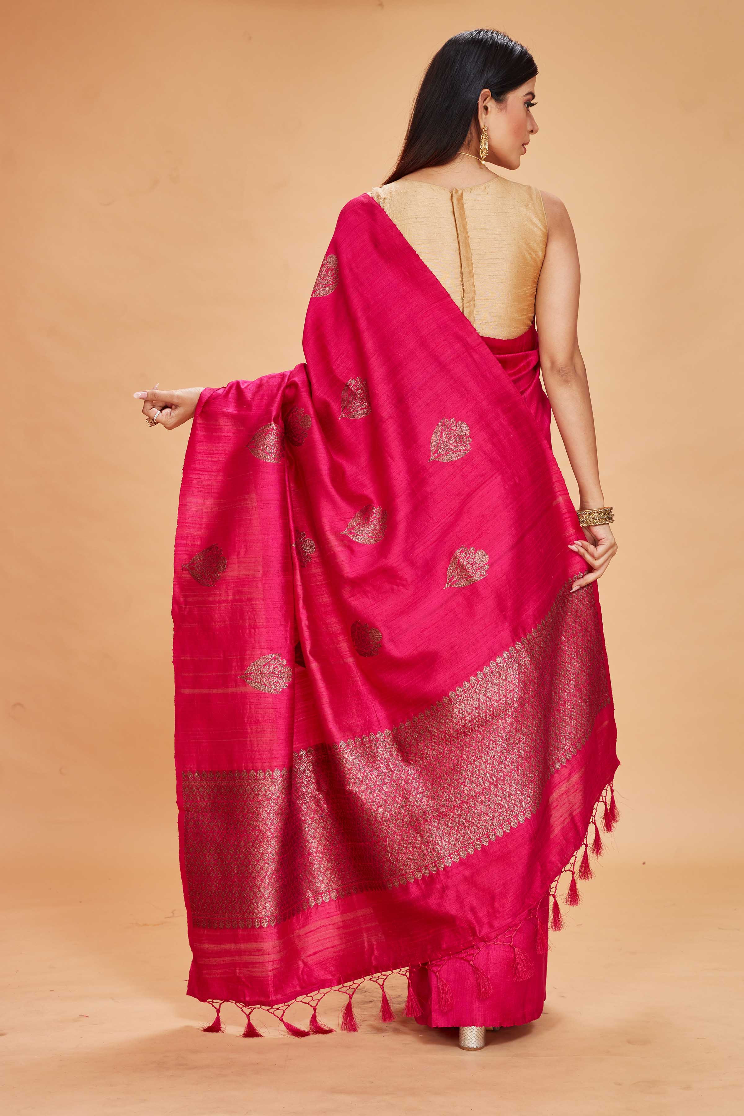 Shop beautiful rani pink tussar Banarasi sari online in USA with antique zari pallu. Look your best on festive occasions in latest designer saris, pure silk sarees, Kanjivaram silk sarees, handwoven saris, tussar silk sarees, embroidered saris from Pure Elegance Indian clothing store in USA.-back