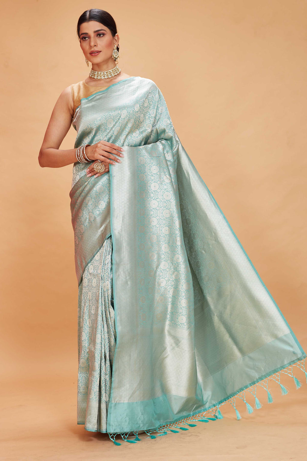 Shop pastel green Katan Banarasi saree online in USA with floral zari jaal. Look your best on festive occasions in latest designer saris, pure silk sarees, Kanjivaram silk sarees, handwoven saris, tussar silk sarees, embroidered sarees from Pure Elegance Indian clothing store in USA.-full view