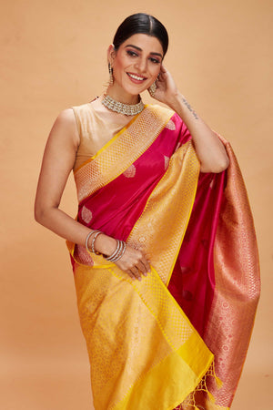 Shop red Katan Banarasi saree online in USA with yellow zari border. Look your best on festive occasions in latest designer saris, pure silk sarees, Kanjivaram silk sarees, handwoven saris, tussar silk sarees, embroidered sarees from Pure Elegance Indian clothing store in USA.-closeup