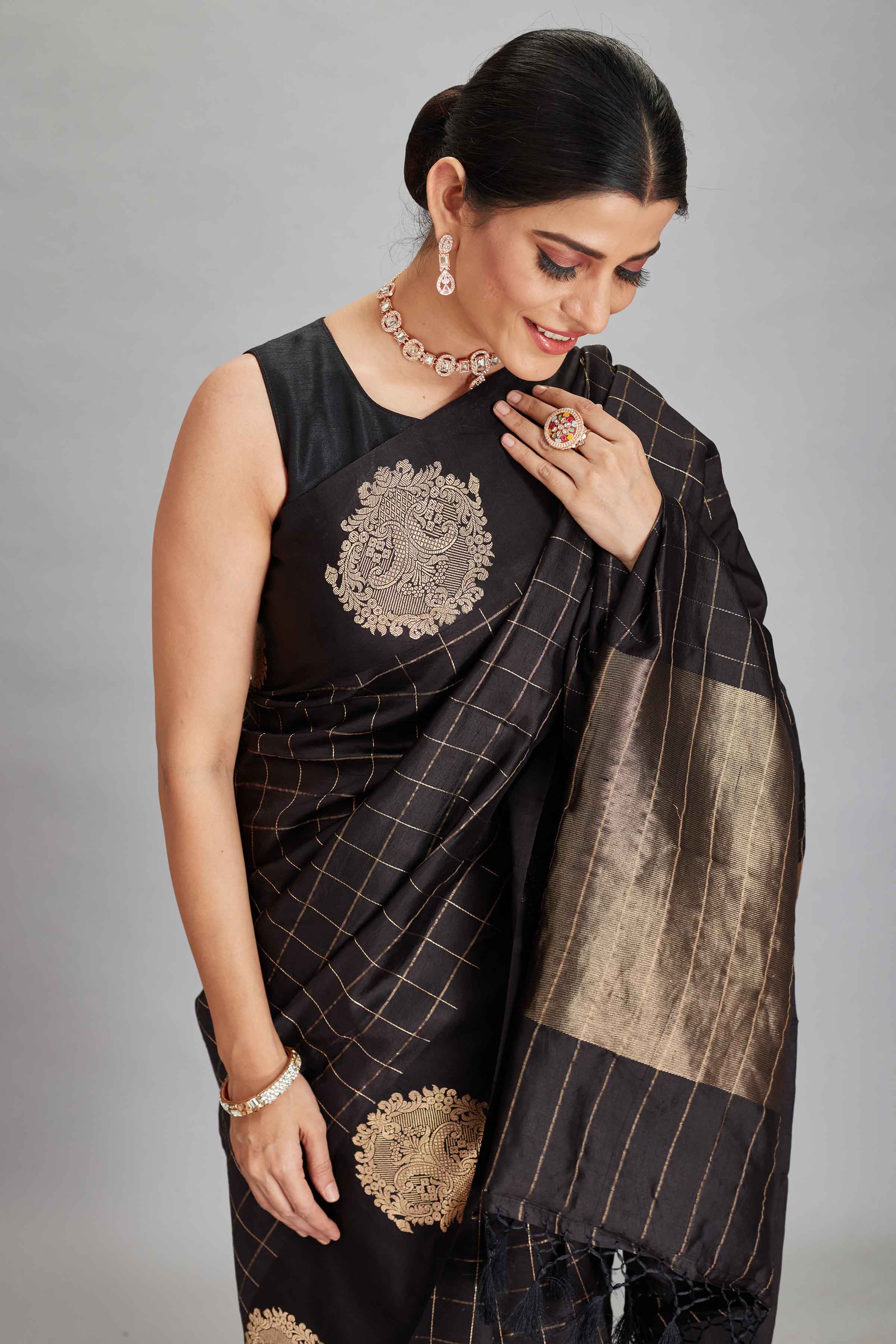 Buy black check silk Banarasi sari online in USA with zari motifs border. Look your best on festive occasions in latest designer sarees, pure silk sarees, Kanjivaram silk saris, handwoven saris, tussar silk sarees, embroidered saris from Pure Elegance Indian clothing store in USA.-closeup