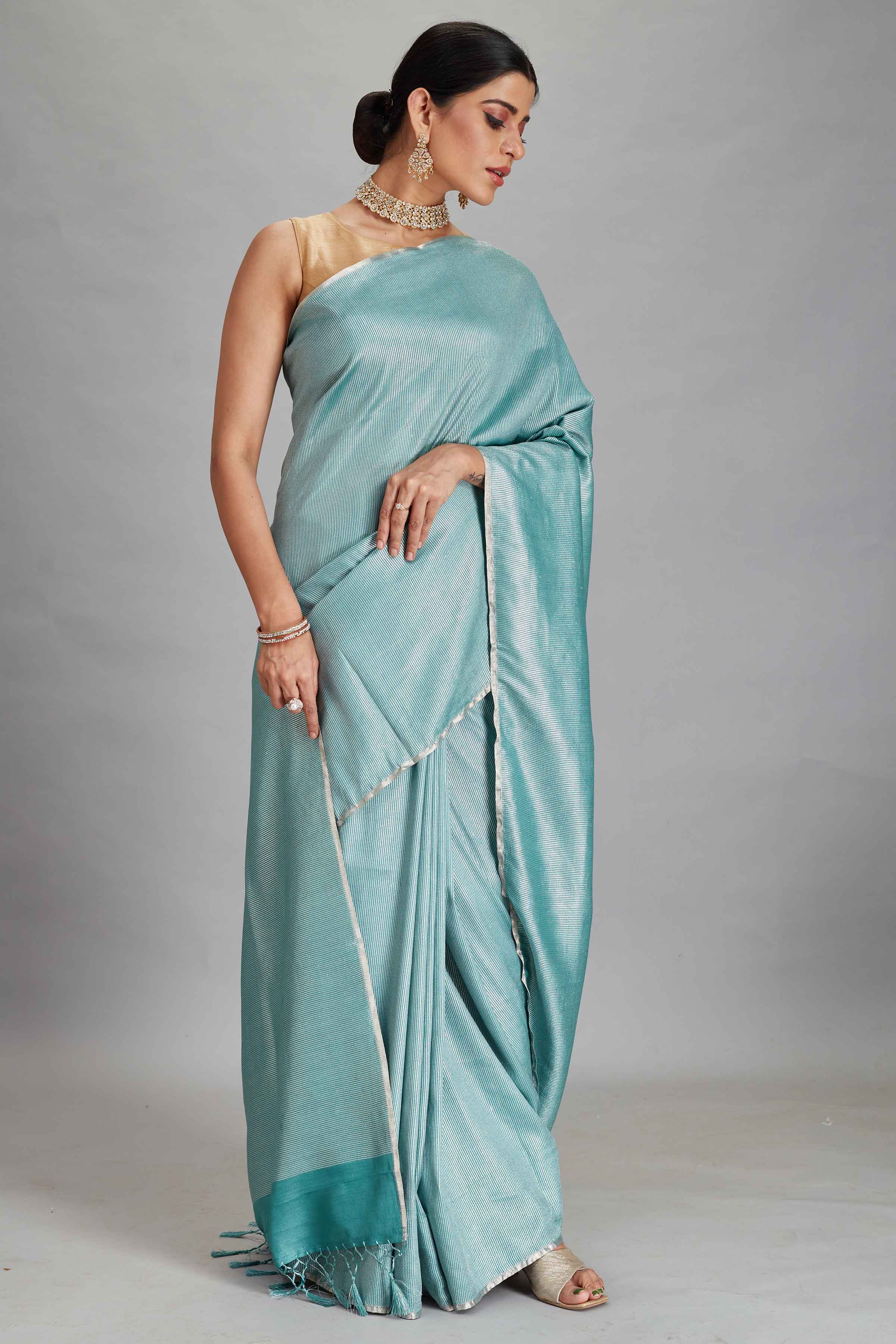 Buy pastel green muga Banarasi saree online in USA with zari stripes. Look your best on festive occasions in latest designer sarees, pure silk sarees, Kanjivaram silk saris, handwoven saris, tussar silk sarees, embroidered saris from Pure Elegance Indian clothing store in USA.-front