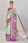 Buy pastel green Kora Banarasi sari online in USA with overall zari jaal. Look your best on festive occasions in latest designer sarees, pure silk sarees, Kanjivaram silk saris, handwoven saris, tussar silk sarees, embroidered saris from Pure Elegance Indian clothing store in USA.-full view