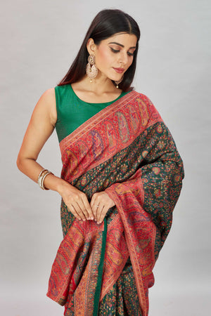 Buy stunning green Kani weave sari online in USA with multicolor red border. Look your best on festive occasions in latest designer sarees, pure silk sarees, Kanjivaram silk sarees, handwoven sarees, tussar silk sarees, embroidered saris from Pure Elegance Indian clothing store in USA.-closeup