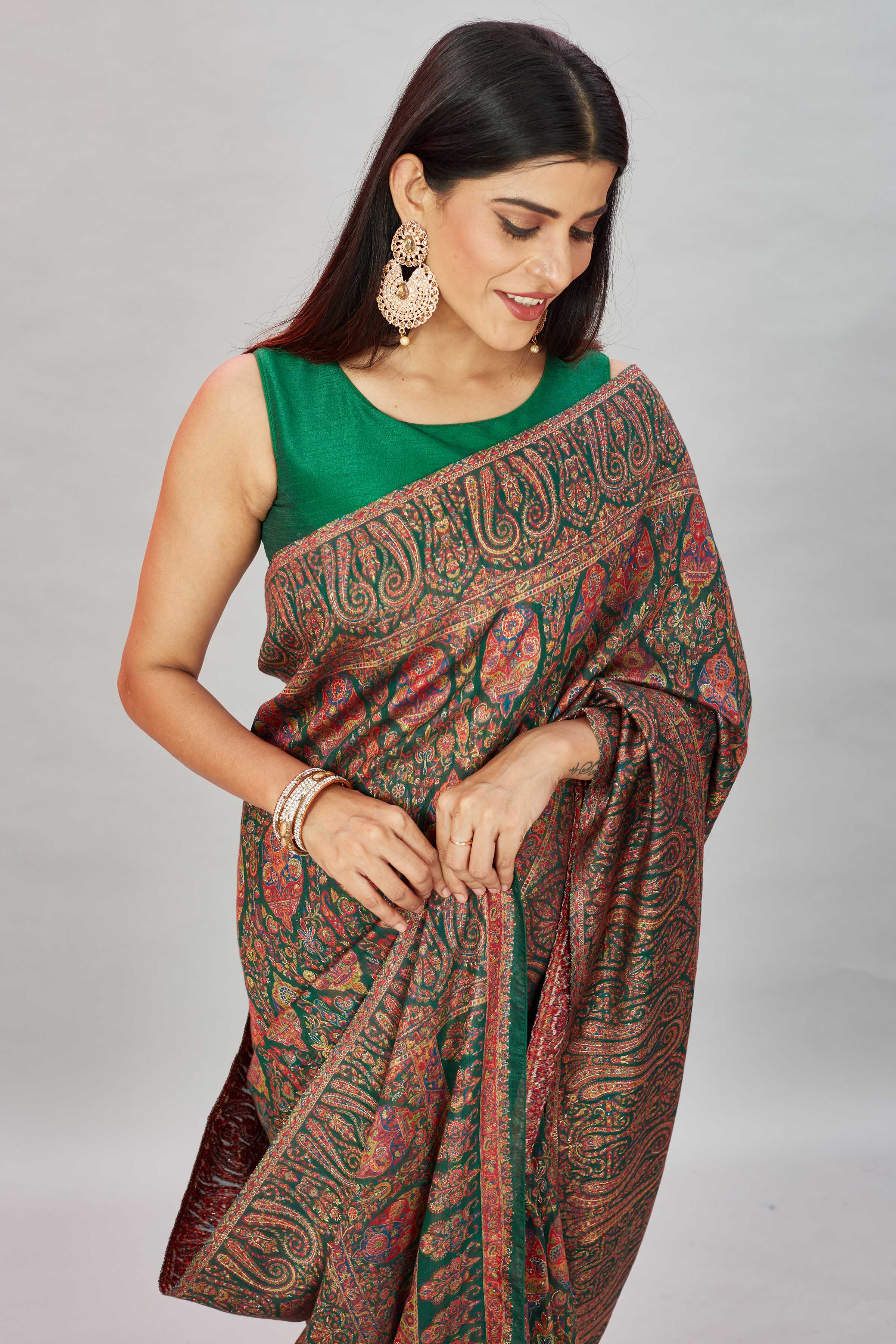 Shop stunning bottle green heavy Kani weave sari online in USA. Look your best on festive occasions in latest designer sarees, pure silk sarees, Kanjivaram silk sarees, handwoven sarees, tussar silk sarees, embroidered saris from Pure Elegance Indian clothing store in USA.-closeup