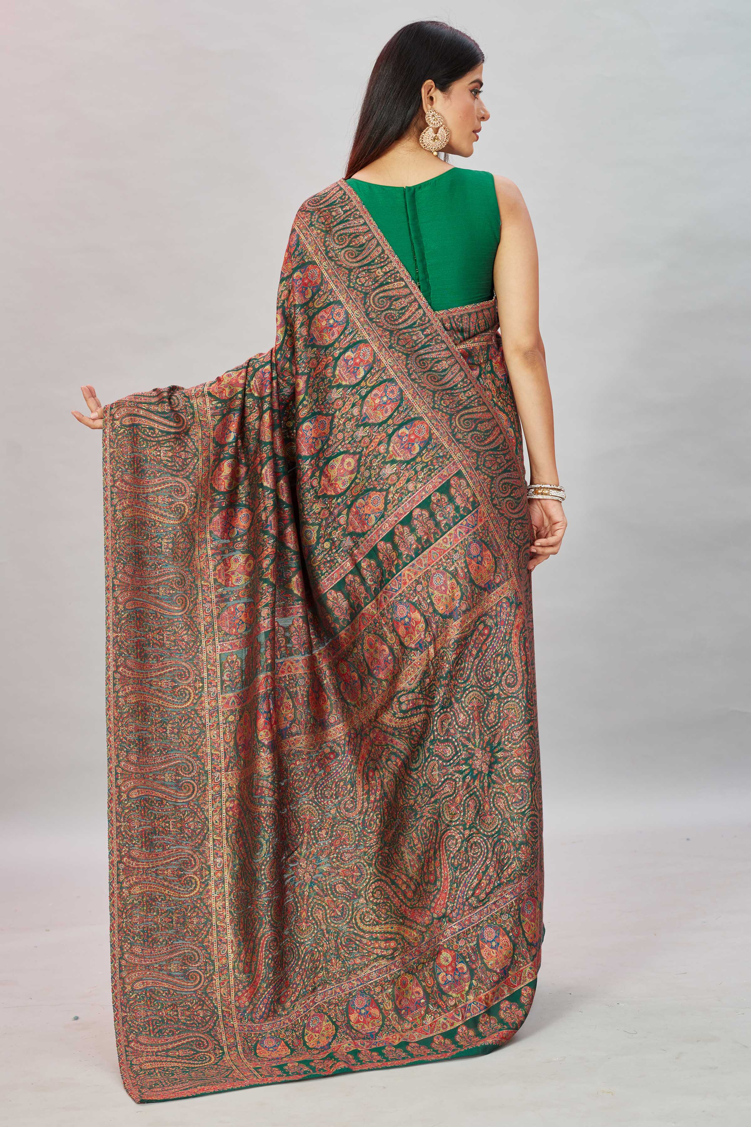 Shop stunning bottle green heavy Kani weave sari online in USA. Look your best on festive occasions in latest designer sarees, pure silk sarees, Kanjivaram silk sarees, handwoven sarees, tussar silk sarees, embroidered saris from Pure Elegance Indian clothing store in USA.-back