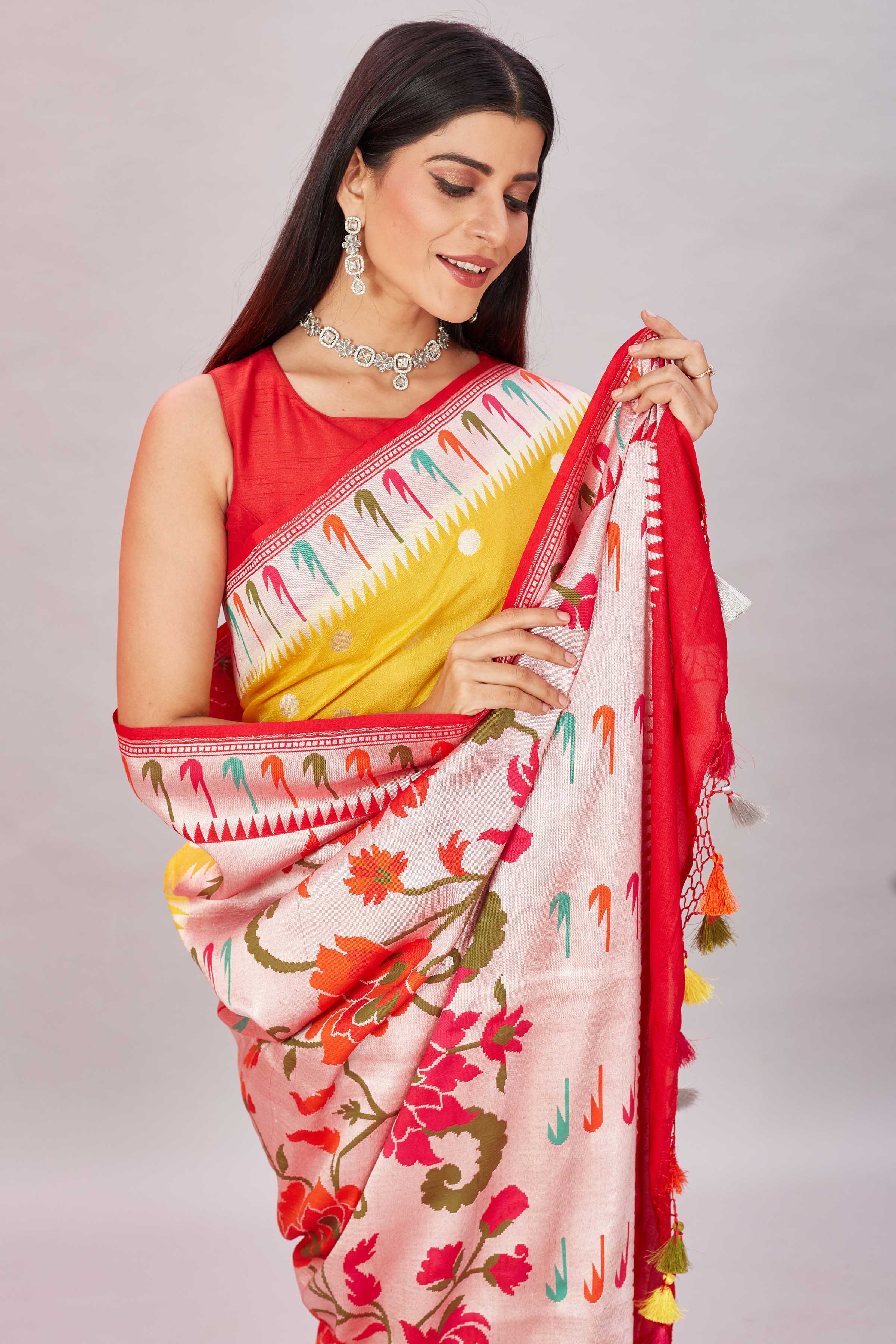 Shop yellow tussar Banarasi saree online in USA with Paithani border. Look your best on festive occasions in latest designer sarees, pure silk sarees, Kanjivaram silk sarees, handwoven saris, tussar silk sarees, embroidered saris from Pure Elegance Indian clothing store in USA.-closeup