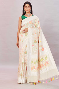 Shop cream tussar Banarasi saree online in USA with zari minakari floral jaal. Look your best on festive occasions in latest designer sarees, pure silk sarees, Kanjivaram silk sarees, handwoven saris, tussar silk sarees, embroidered saris from Pure Elegance Indian clothing store in USA.-full view